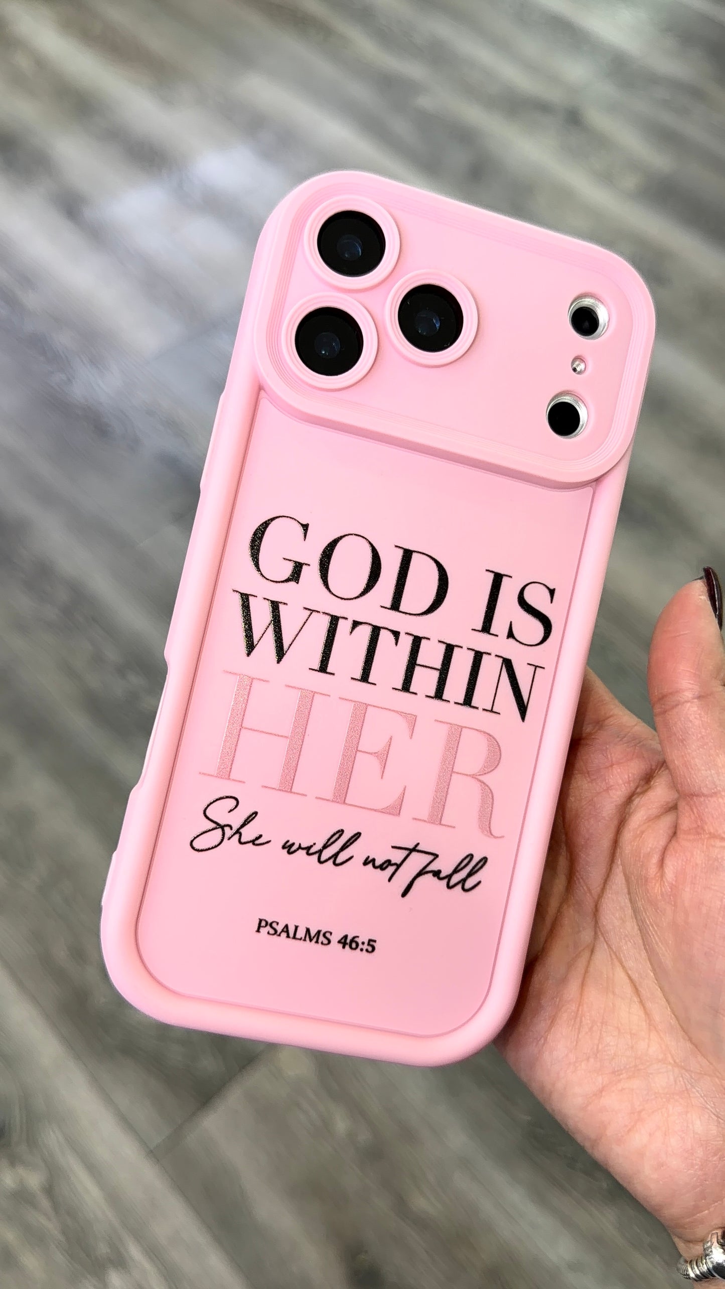 Pink silicon smartphone case with camera protection with saying "God is within her"