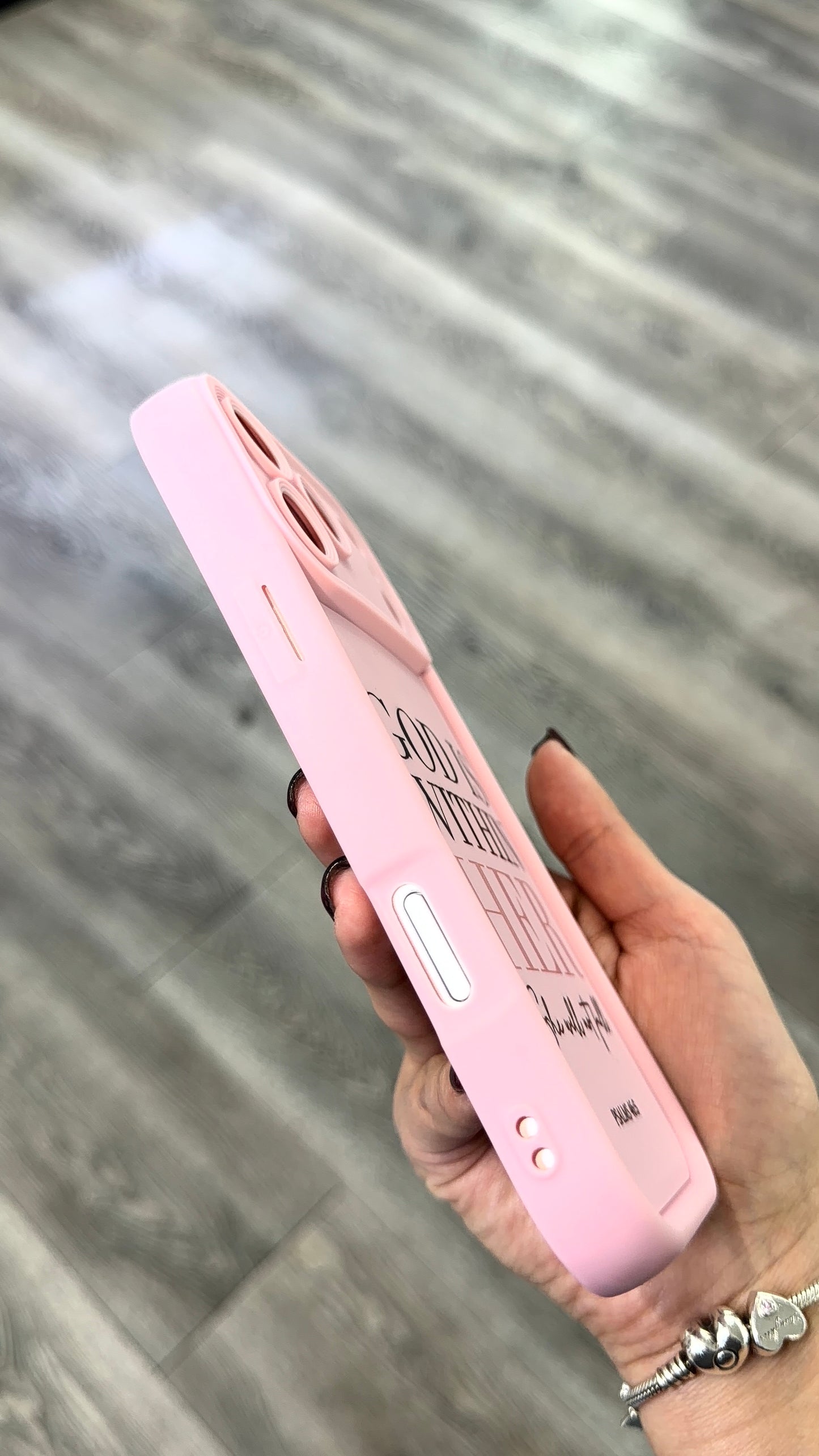 Pink silicon smartphone case with camera protection with saying "God is within her"
